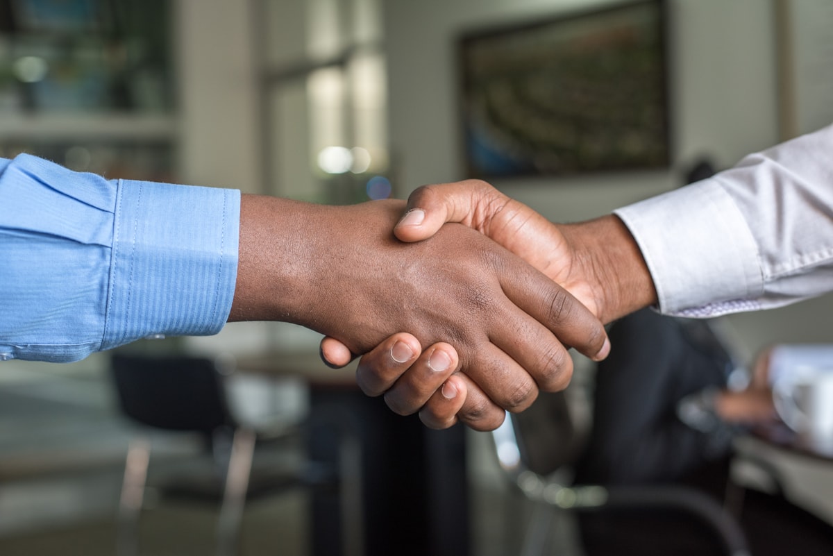 Handshake sealing a trusted rental agreement